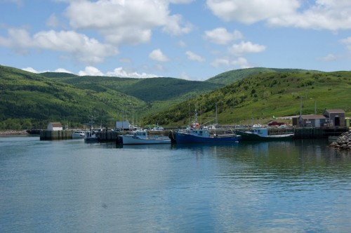 Panoramic views of fishing boats and mountains at the Acadian fishing village of Grand Etang on the Cabot Trail - Credit Photo Nova Scotia Tourism