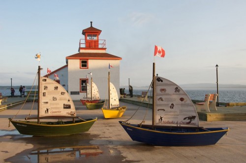 lighthouse replica, surrounded by miniature dories, is a new attraction on the waterfront in the Town of Pictou - Credit Photo Nova Scotia Tourism